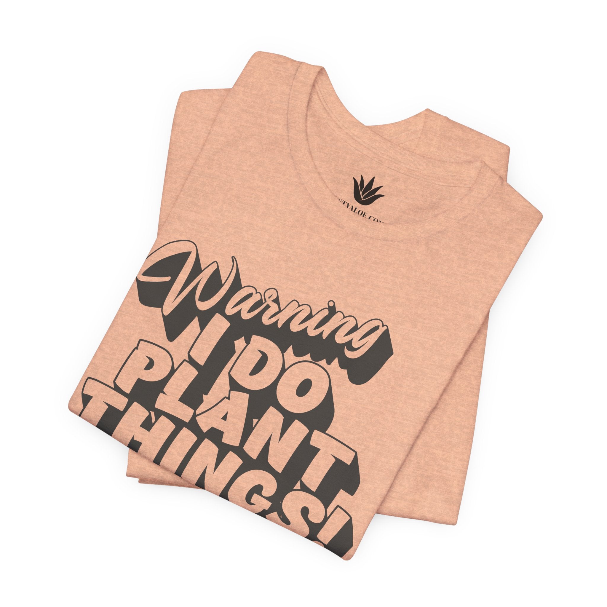Beige t-shirt with black text 'Warning I Do Plant Things' on a white background