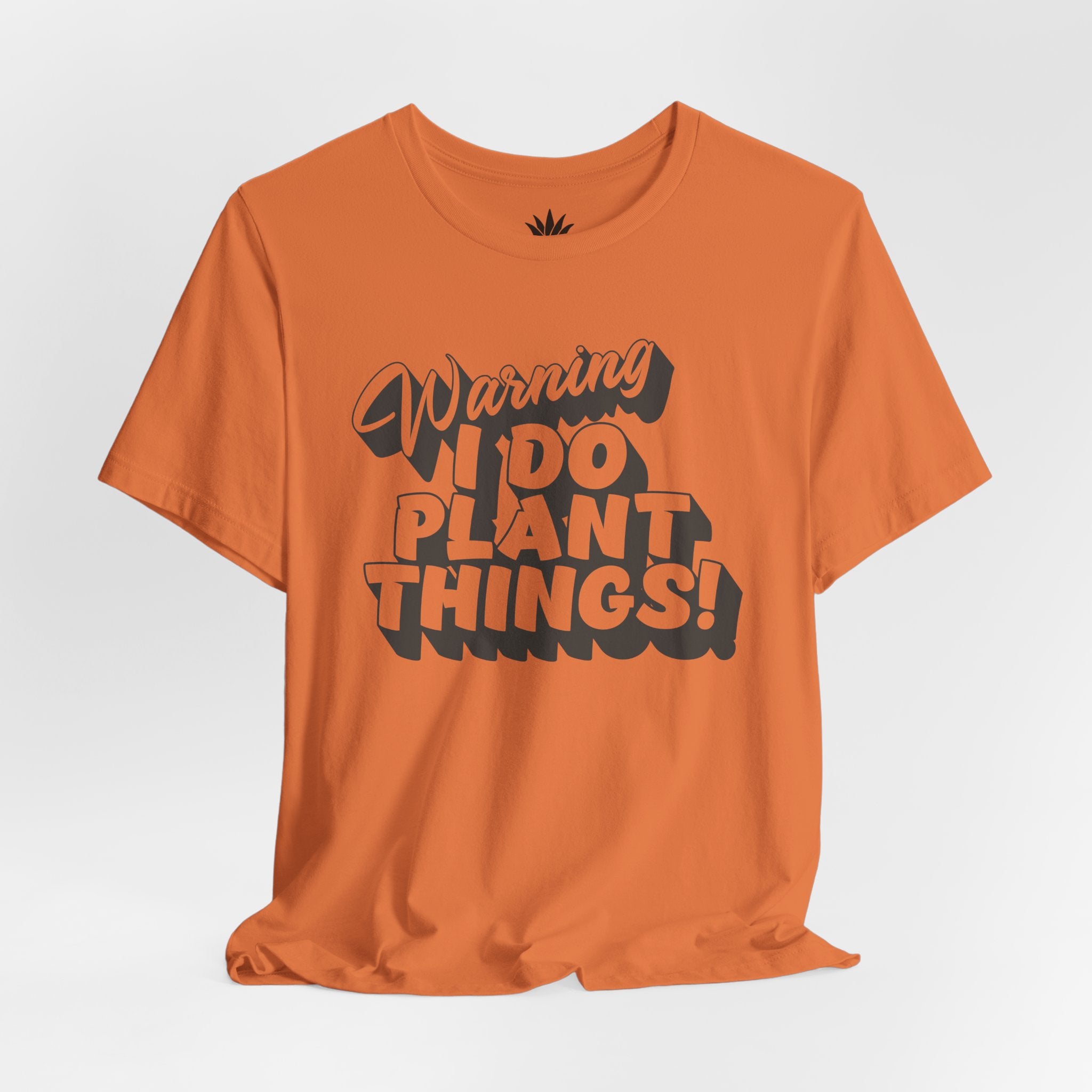 Orange t-shirt with text 'Warning I Do Plant Things!' on a white background