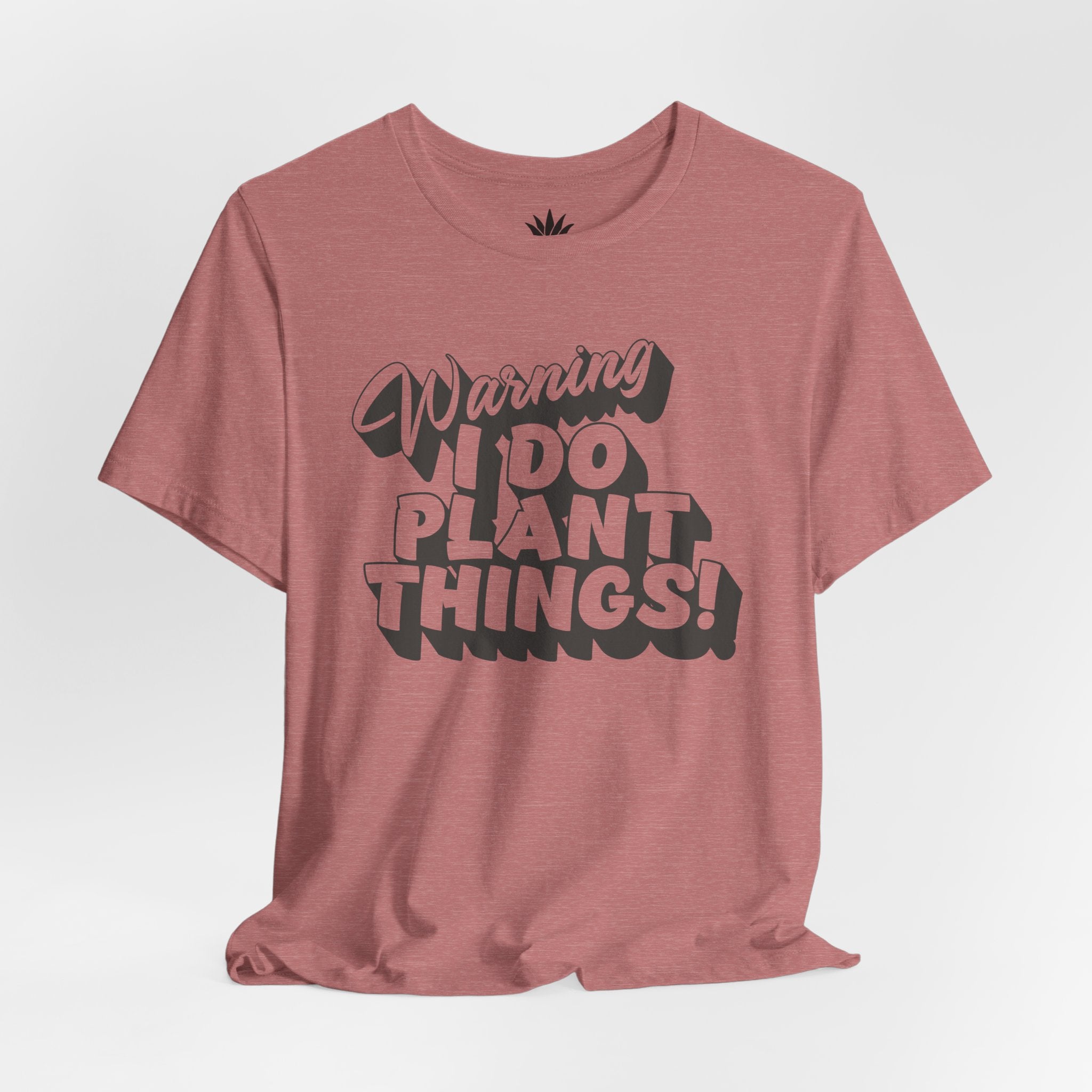 Pink t-shirt with text 'Warning I Do Plant Things!' on a white background