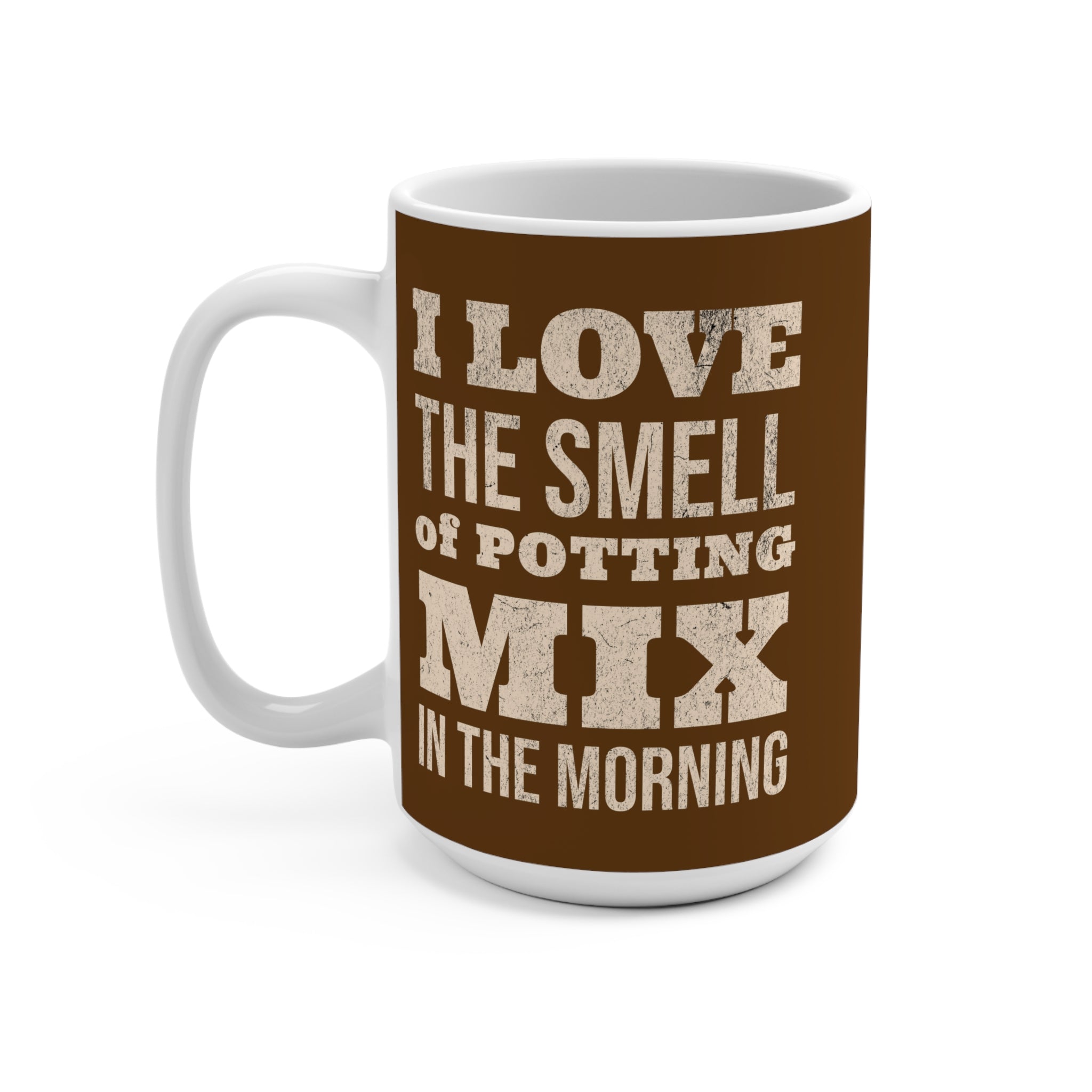 Mug with text 'I love the smell of potting mix in the morning' on a brown background