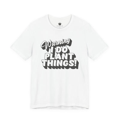 White t-shirt with black text 'Warning I Do Plant Things!' on a white background