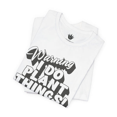 White t-shirt with black text 'Warning I do plant things!' on a white background