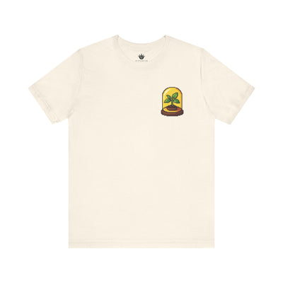 Beige t-shirt with a small graphic on the chest against a white background