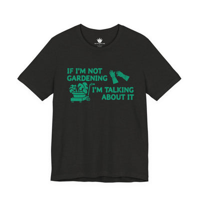 Black t-shirt with green text and graphics on a white background