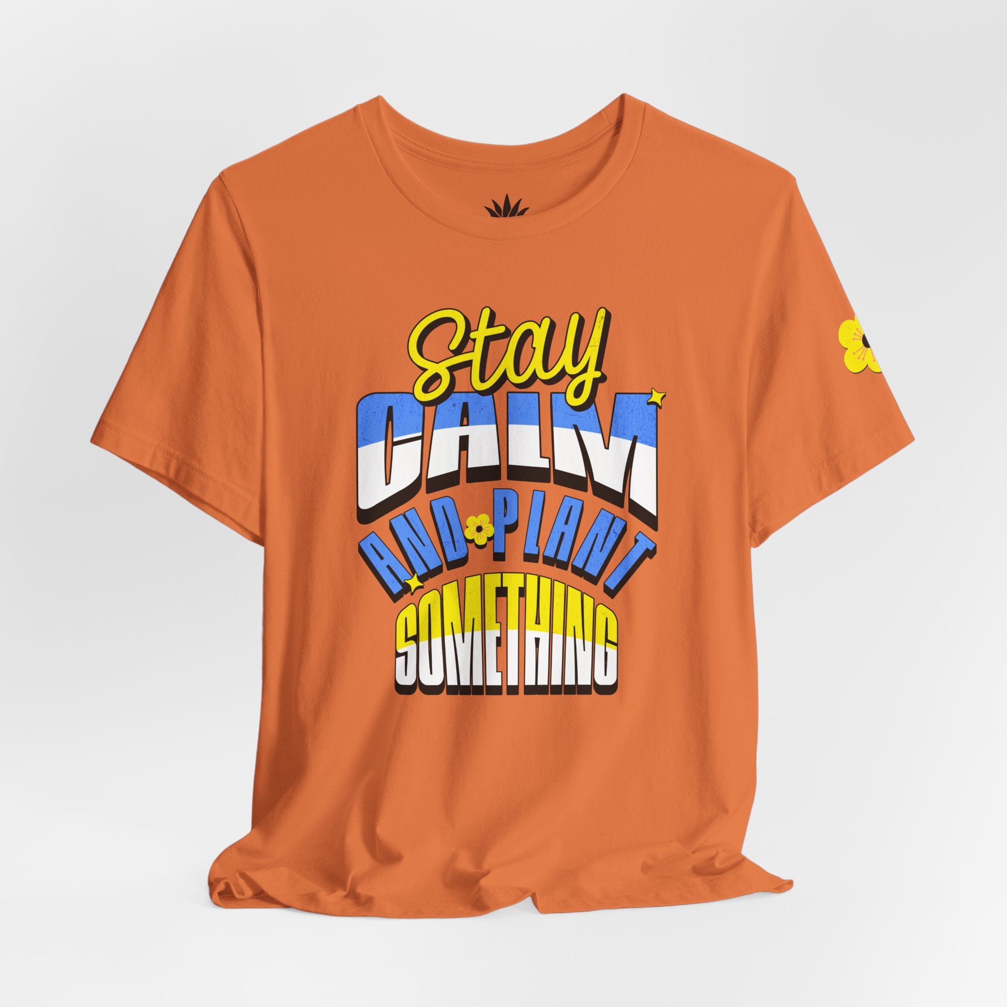 Orange t-shirt with colorful text design on a white background