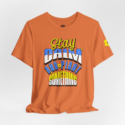Orange t-shirt with colorful text design on a white background