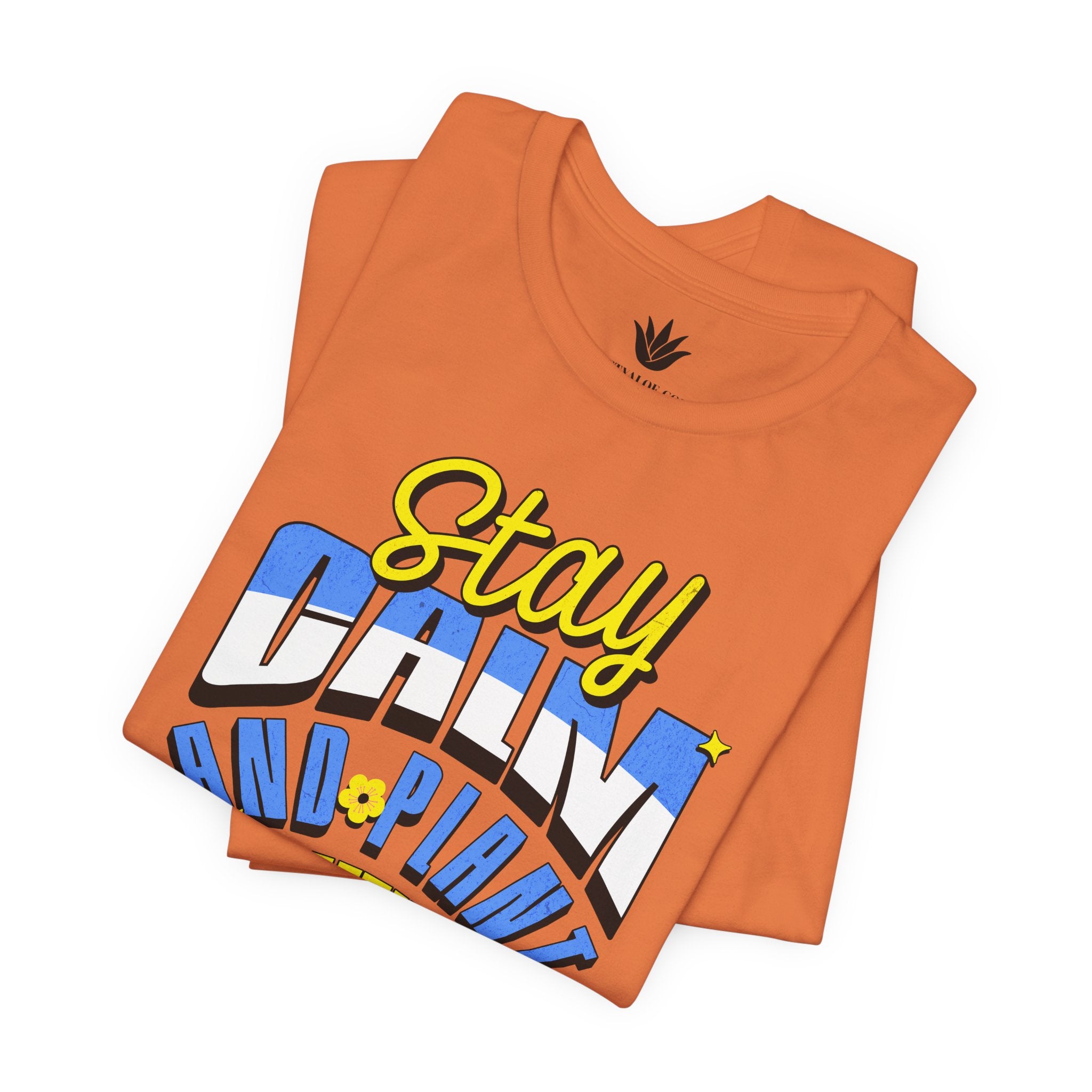 Orange t-shirt with colorful text design on a white background