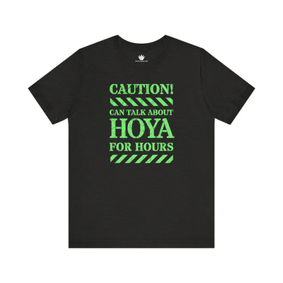 Black t-shirt with green text on a white background