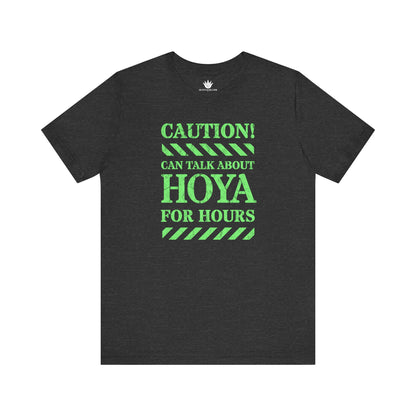Gray t-shirt with green text 'CAUTION! CAN TALK ABOUT HOYA FOR HOURS' on a white background