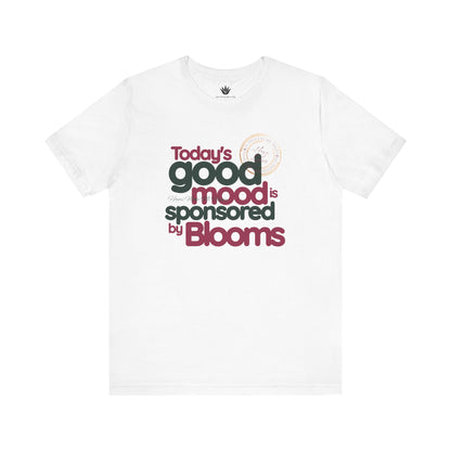 White t-shirt with text 'Today's good mood is sponsored by Blooms' on a white background