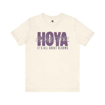 Beige t-shirt with purple text on a white background