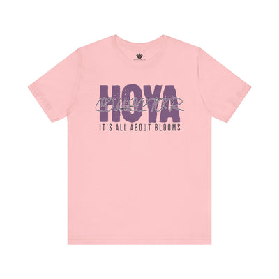 Pink t-shirt with 'HOYA' and 'It's All About Blooms' text on a white background