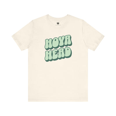 Beige t-shirt with 'HOYA HEAD' text in green on a white background