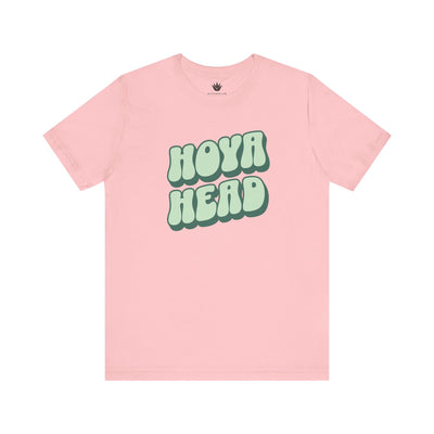 Pink t-shirt with 'HOYA HEAD' text on a white background
