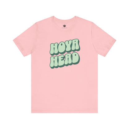 Pink t-shirt with 'HOYA HEAD' text on a white background