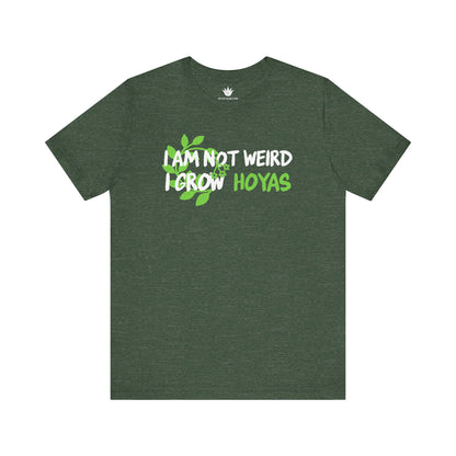 Green t-shirt with text 'I am not weird, I grow Hoyas' on a white background