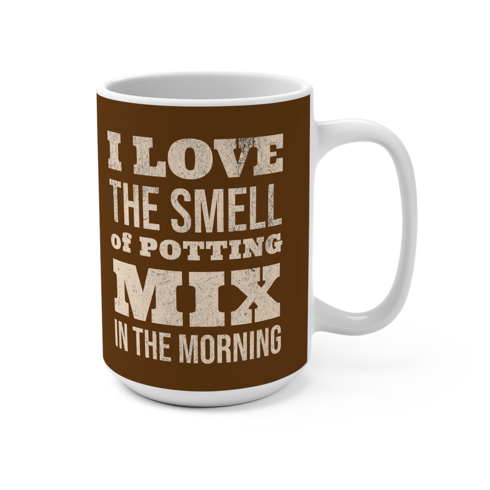 Mug with text 'I love the smell of potting mix in the morning' on a brown background