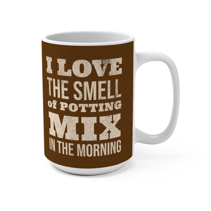 Mug with text 'I love the smell of potting mix in the morning' on a brown background