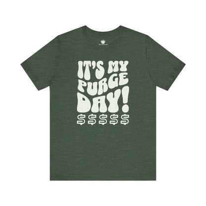 Green t-shirt with white text 'It's my purge day! $$$$$' on a white background