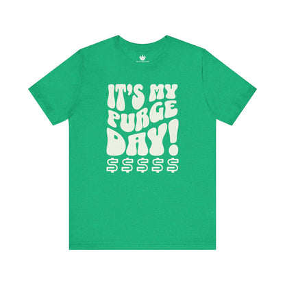 Green t-shirt with white text 'IT'S MY PURGE DAY! $$$$$' on a white background