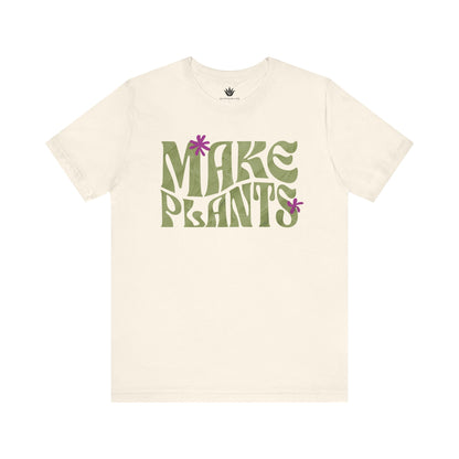 Beige t-shirt with 'MAKE PLANTS' text and flower graphics on a white background