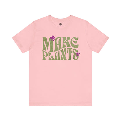 Pink t-shirt with 'MAKE PLANTS' text on a white background