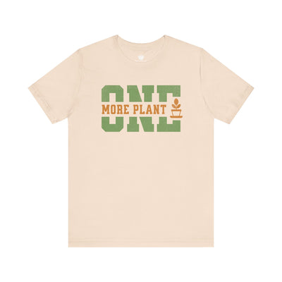 Beige t-shirt with 'ONE MORE PLANT' text on a white background