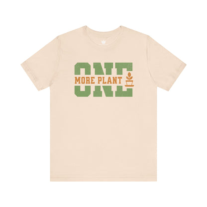 Beige t-shirt with 'ONE MORE PLANT' text on a white background
