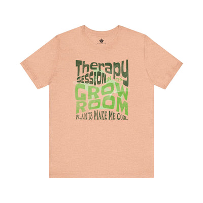 Pink t-shirt with green and black text on a white background