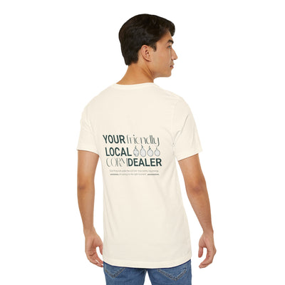 Man wearing a cream t-shirt with text on the back, standing against a white background