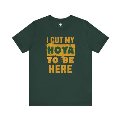 Green t-shirt with yellow text 'I cut my Hoya to be here' on a white background