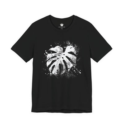Black t-shirt with white leaf design on a white background