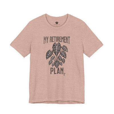 Beige t-shirt with black text and plant graphic on a white background