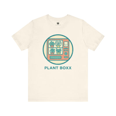 Beige unisex t-shirt with colorful retro vending machine design filled with potted plants and text “Plant Boxx” – perfect for plant lovers.