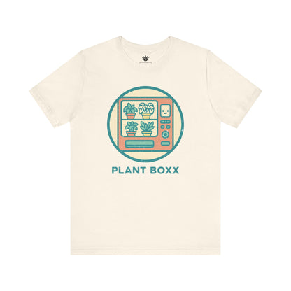Beige unisex t-shirt with colorful retro vending machine design filled with potted plants and text “Plant Boxx” – perfect for plant lovers.