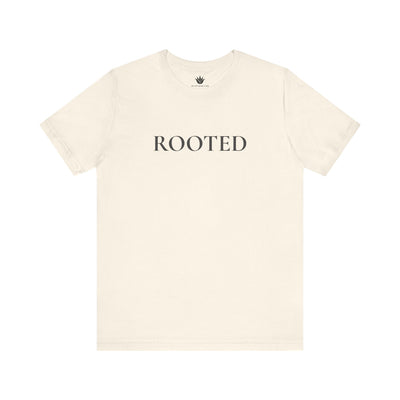 Beige t-shirt with 'ROOTED' text on a white background