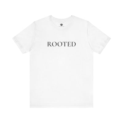 White t-shirt with 'ROOTED' text on a white background