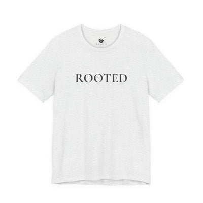 White t-shirt with 'ROOTED' text on a white background