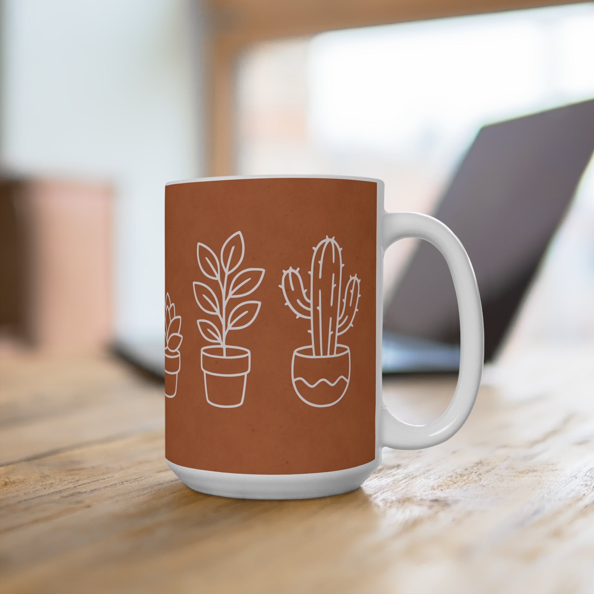 Mug with plant illustrations on a wooden surface